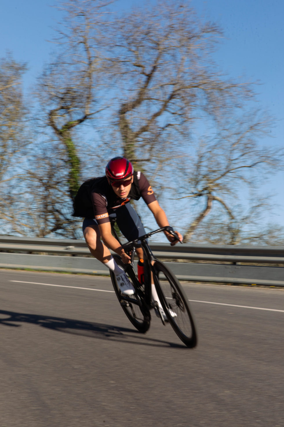 Tymon leaning into a corner on his road bike